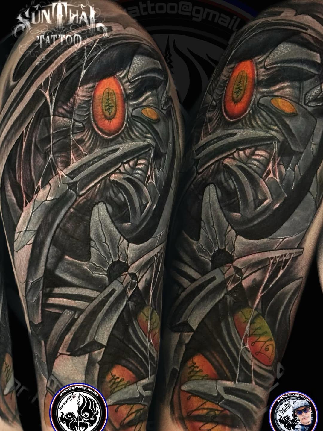 Biomechanical colour sleeve tattoo