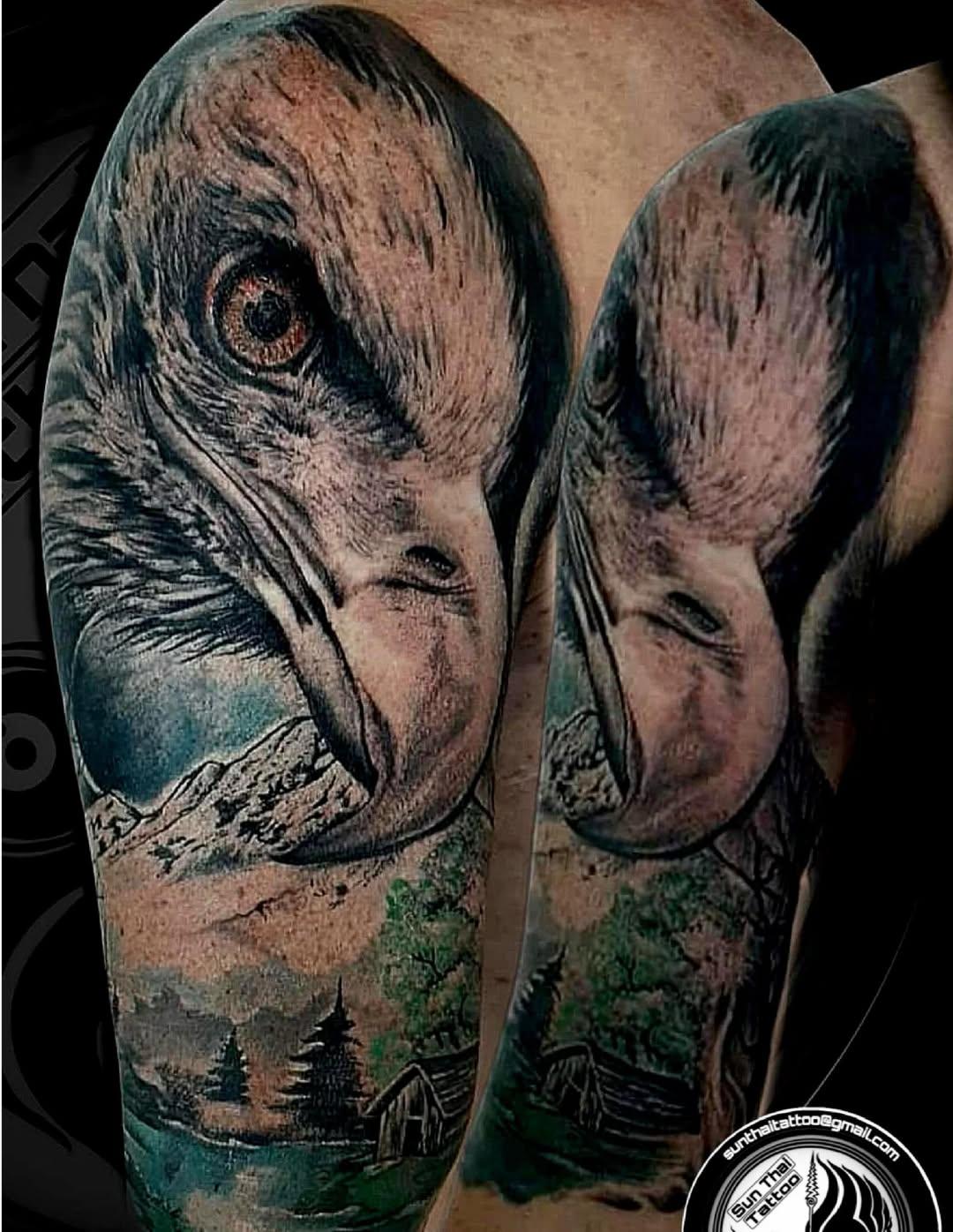 Realistic eagle and landscape sleeve tattoo